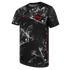 A black short-sleeved Canada national soccer team jersey featuring a white splatter pattern that forms large, stylized maple leaf motifs. A red Nike swoosh is on the right chest, and a red and black circular Canada Soccer crest with "CANADA" text is on th