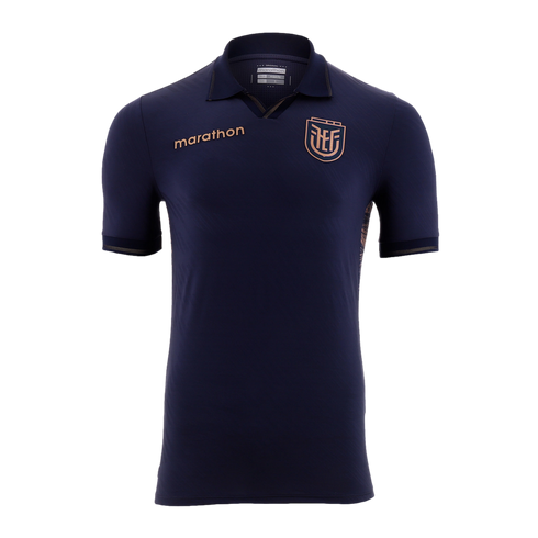 A navy blue short-sleeved polo jersey featuring a metallic bronze "marathon" logo on the right chest and the Ecuadorian Football Federation (FEF) crest on the left. It has subtle metallic trim on the collar and sleeve cuffs, set against a solid black back