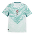 A white and teal Puma soccer jersey for the Portugal national team, featuring a stylized wave-like chevron pattern. The red and blue FPF crest is centered on the chest above a maroon Puma logo.