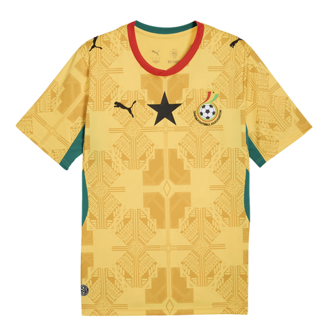 A yellow Ghana national team football jersey featuring a subtle tone-on-tone geometric pattern, a large black star on the center chest, the Puma logo, and the Ghana Football Association crest. The jersey has red and green trim on the collar and side panel