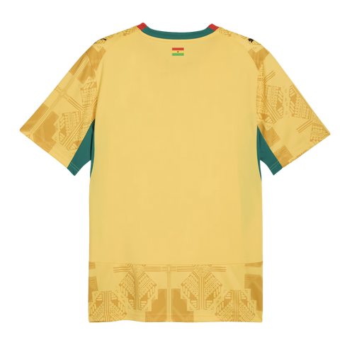 A yellow short-sleeved soccer jersey shown from the back, featuring green side panels, a red and green collar, and a small flag of Ghana on the back of the neck. Tonal geometric patterns are printed on the sleeves and the bottom hem.