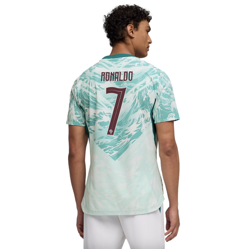 A man seen from behind wearing a light teal and white patterned Portugal soccer jersey with "RONALDO" and the number "7" printed in maroon on the back.