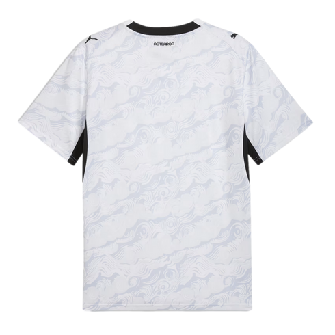 A back view of a white Puma sports jersey featuring a subtle, light gray swirling wave pattern across the entire garment. The shirt has a black crew neckline, black Puma logos on each shoulder, and the word "AOTEAROA" printed in black on the upper back.