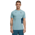 A studio photograph of a man modeling a light teal short-sleeved Puma training t-shirt with a Portuguese Football Federation crest on the chest, paired with matching teal pants, against a solid black background.