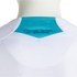 A close-up of the back of a white textured sports jersey, featuring a bright turquoise triangular panel at the nape of the neck. The panel contains small ventilation holes and dark blue handwritten-style text that reads "SELECCIÓN NACIONAL DE HONDURAS."