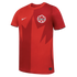 A red Nike Canada soccer jersey featuring a two-tone split design and a large stylized maple leaf graphic across the front.