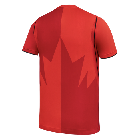 The back of a short-sleeved red athletic jersey against a solid black background. A large, stylized maple leaf design spans the back, split vertically with contrasting shades of lighter and darker red on either side. Thin black lines trim the sleeve cuffs