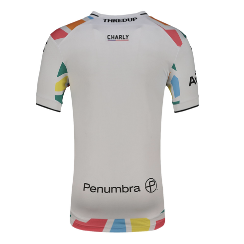 The back of a white short-sleeved sports jersey with colorful geometric patterns on the sleeves and hem. Several black logos are centered on the back, including "THREDUP", "CHARLY", and "Penumbra."