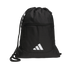 A black Adidas drawstring gym bag with a white logo on the front, a zippered pocket, and three white stripes on the side, set against a black background.