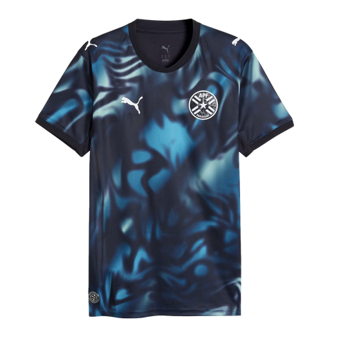 Puma Paraguay national team soccer jersey featuring a dark navy and blue abstract swirl pattern, white Puma logos, and the APF team crest.
