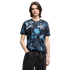 A man with brown hair wears a blue and black abstract Puma jersey with the Paraguay football crest and black jeans against a solid black background.