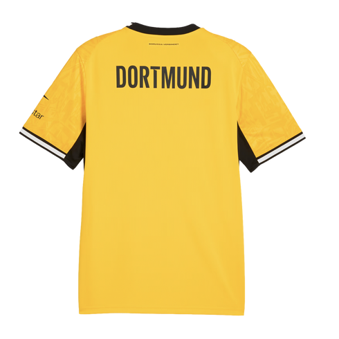 Back view of a yellow Borussia Dortmund jersey with "DORTMUND" in large black letters, black and white striped sleeve cuffs, and a subtle geometric pattern.