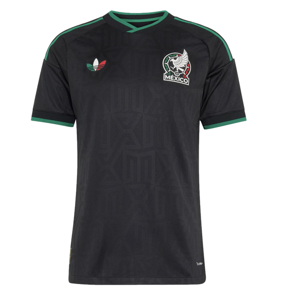 Black Mexico soccer jersey with green trim, a tricolor Adidas logo, and team crest. Tonal geometric patterns are visible on the black fabric.