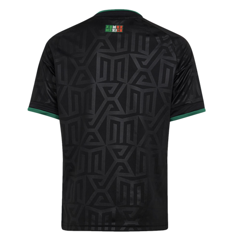The back of a black soccer jersey featuring a subtle tonal geometric pattern, green accents on the collar and cuffs, and a small "SOMOS MEXICO" logo on the upper back.