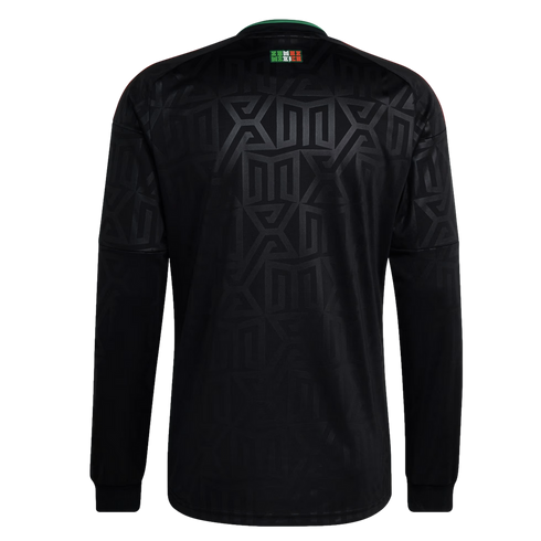 Back of a black long-sleeved jersey with a tonal geometric pattern and a small green, white, and red "MEXICO" logo on the upper back.