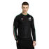 A man in a black long-sleeve Mexico national team jersey with a geometric pattern, green-white-red accents, and an eagle crest, posed against a white background.