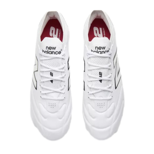 Top-down view of white New Balance athletic shoes with white laces and black logo accents.