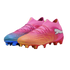 A pair of mismatched pink Puma soccer cleats: one with an orange gradient toe and red studs, the other with a blue gradient toe and blue studs.