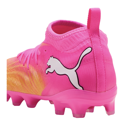 A bright pink and orange Puma soccer cleat with a white logo and a sock-like ankle collar.