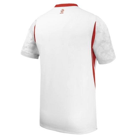 Back view of a white sports jersey with red side panels and collar, featuring patterned short sleeves and a small red logo on the upper back.