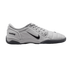 Profile of a light grey Nike Total 90 III indoor soccer shoe featuring a black swoosh and a dark grey sole.