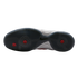 Bottom view of a grey Nike athletic shoe outsole featuring a herringbone traction pattern with three red circular accents, set against a plain white background.