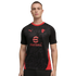 A man modeling a black Puma soccer jersey with red accents and the eFootball logo on a black background.