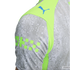 Close-up of a Puma jersey sleeve featuring a gray water droplet pattern, a neon green panel with a blue Puma logo, and lime green blocky graphics.