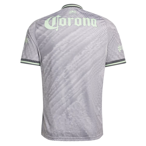 Back view of a grey soccer jersey with a wavy pattern and a large pale green "Corona" logo on the upper back. Features pale green and dark grey trim on the sleeves and collar.