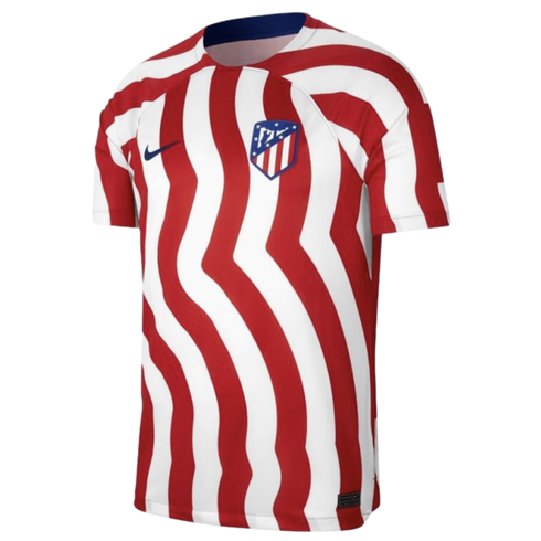An Atlético Madrid home jersey featuring red and white wavy vertical stripes, a navy Nike swoosh, and the club crest.