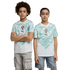 A boy and a girl stand side-by-side against a black background, wearing matching sports jerseys. The jerseys are white with a teal wave-like pattern on the upper half, featuring a team crest and a Puma logo in the center. The boy on the left has curly hai