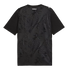The back of a black t-shirt featuring a subtle, tonal pattern of repeating silver ferns. The word "AOTEAROA" is printed in white block letters below the collar, and a white Puma logo is on the right shoulder.