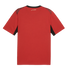 The back view of a red short-sleeved athletic jersey featuring a black collar, maroon shoulder panels, and black accents under the sleeves. A small, white Arabic script logo is centered below the back of the neck.