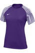 Purple Nike women’s athletic shirt featuring white-striped raglan sleeves and a small white swoosh on the chest.