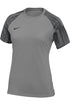 A grey Nike women's athletic t-shirt with short raglan sleeves featuring a black-and-grey striped pattern. A black Nike swoosh logo is on the left chest.