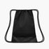 A black drawstring cinch bag with black rope straps shown against a white background. The bottom panel has a smoother finish than the rest of the bag.
