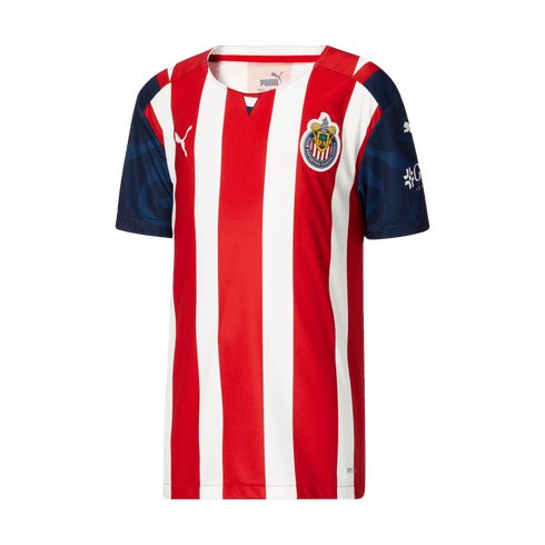 A red and white vertically striped Puma soccer jersey for Club Deportivo Guadalajara, featuring navy blue patterned sleeves and the team's crest on the chest.