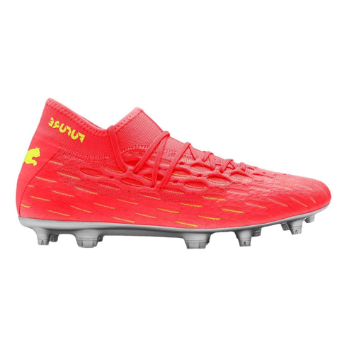 A vibrant red Puma soccer cleat featuring a textured upper, silver sole with studs, and yellow logo on the heel.