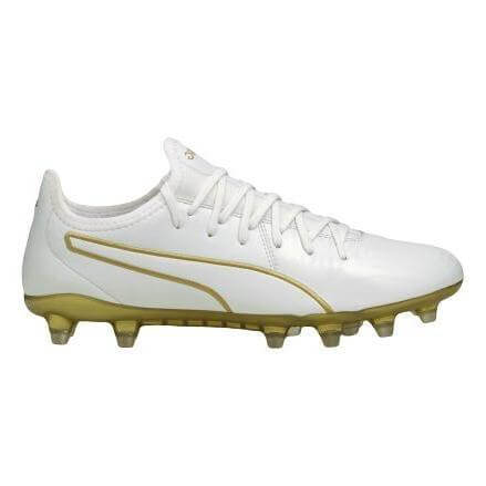 Side profile of a white Puma soccer cleat with gold accents on the logo, soleplate, and studs.