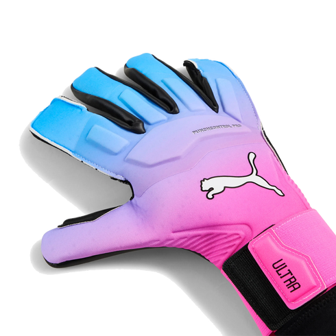A Puma goalkeeper glove with a blue and pink gradient design, featuring a white cat logo and "ULTRA" branding on the wrist strap.