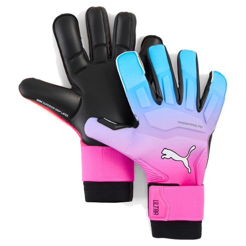 A pair of Puma goalkeeper gloves featuring black palms and a blue-to-pink gradient backhand with a white Puma logo and pink wrist wraps.