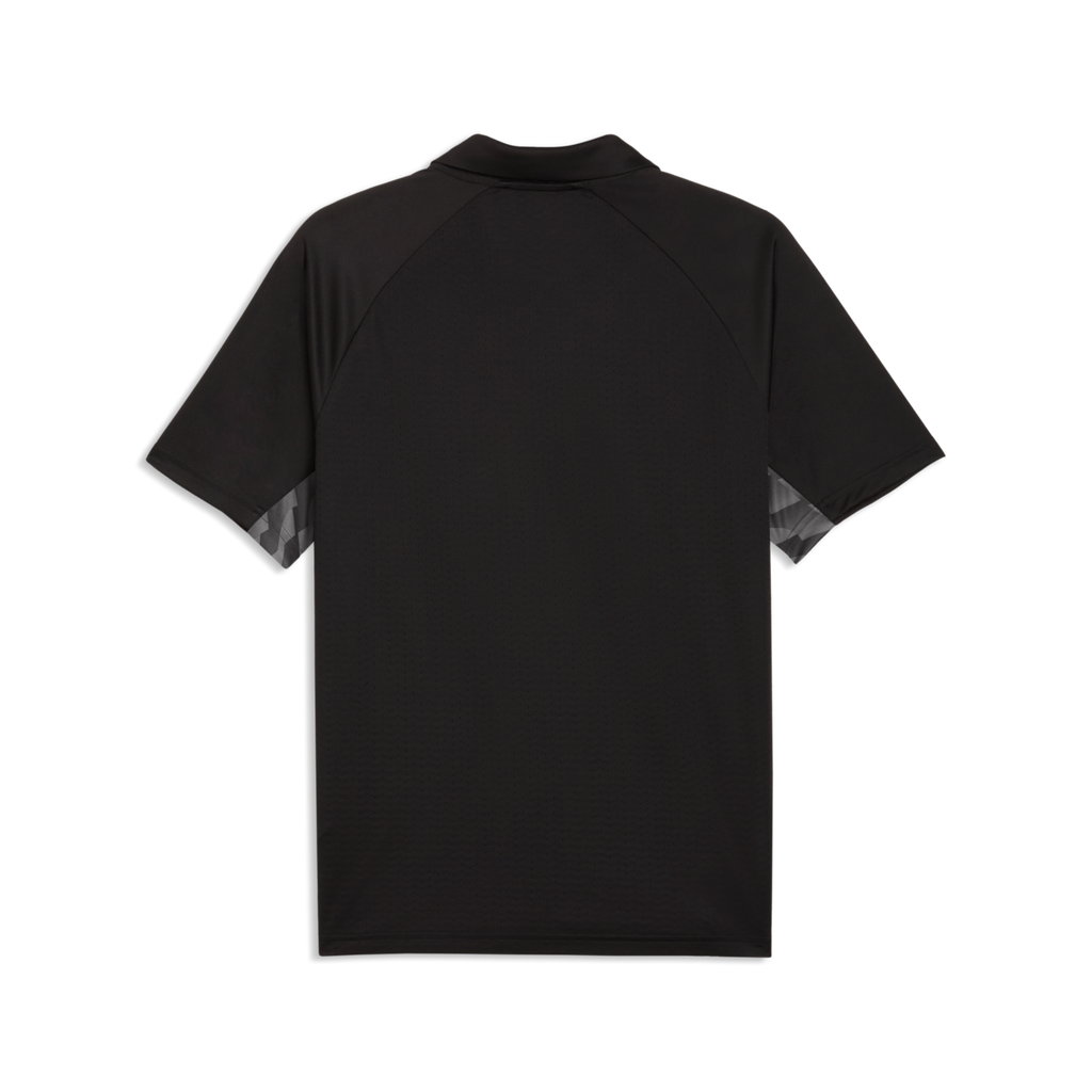 Back view of a black short-sleeved polo shirt with raglan sleeves and grey geometric patterns under the arms, set against a solid black background.