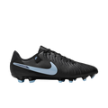 Profile view of a black Nike Tiempo soccer cleat with a light blue swoosh and stud tips, set against a black background.