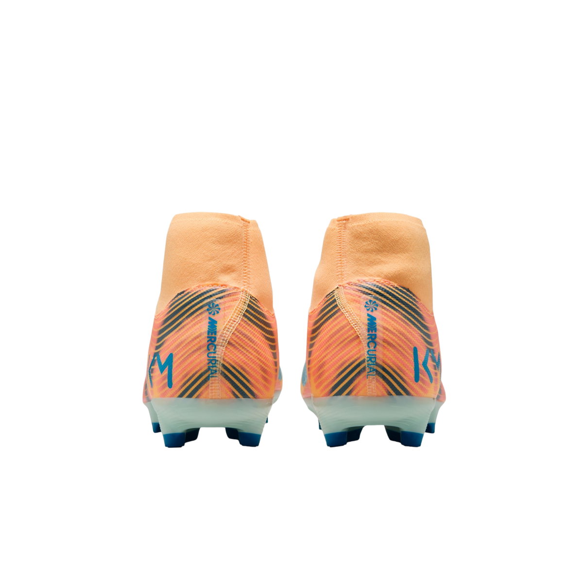 Back view of two orange Nike Mercurial KM soccer cleats with blue and black diagonal patterns and blue studs against a black background.