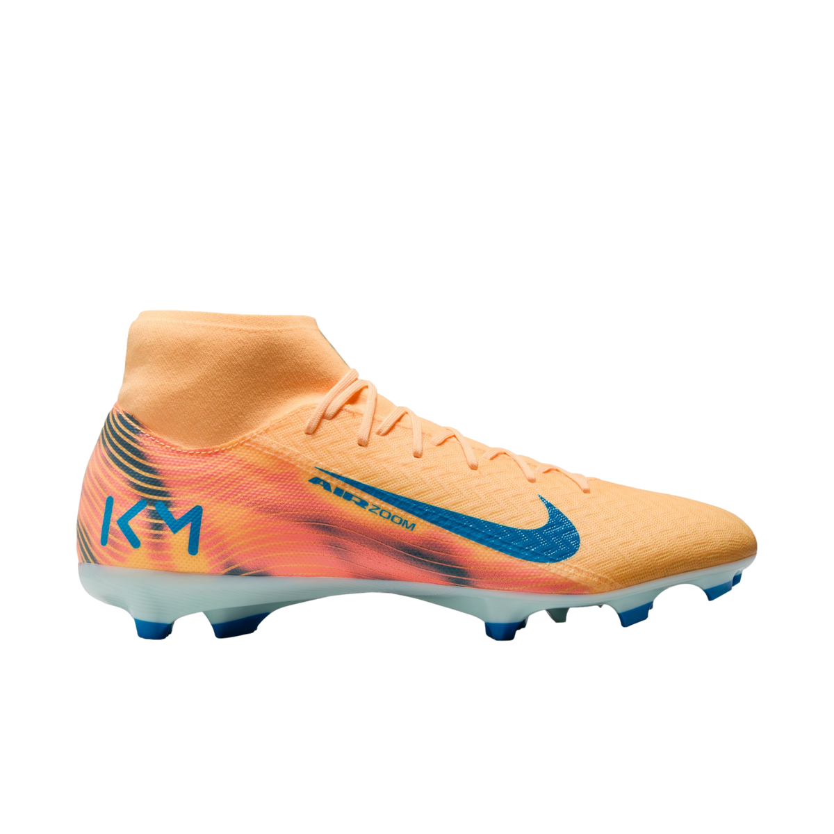 Profile view of a peach and orange Nike soccer cleat with blue accents, featuring a high-top sock collar and a KM logo on the heel.