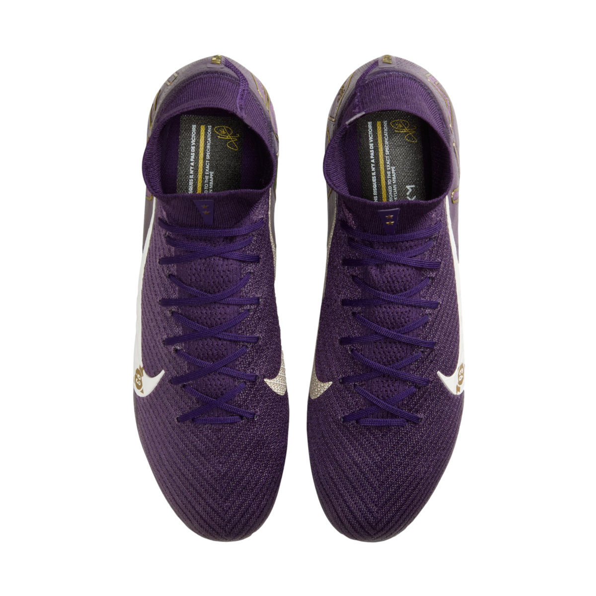 Top-down view of purple Nike soccer cleats with white swooshes and gold accents on a white background.