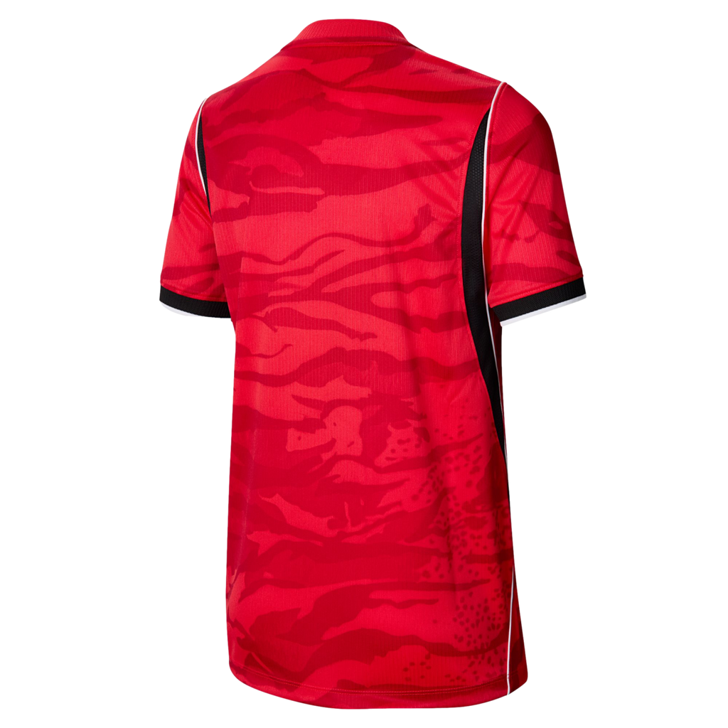 Back view of a red sports jersey with a tonal camouflage pattern. Features black side panels with white piping and striped sleeve cuffs.