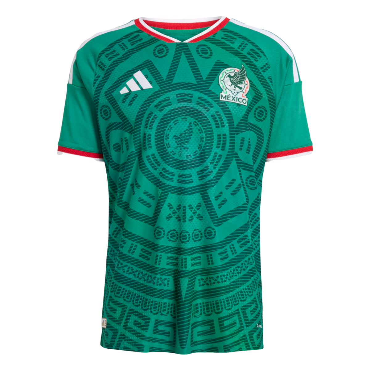 A green Mexico soccer jersey with an intricate dark green Aztec-style pattern, white Adidas logo, Mexico crest, and red and white trim on the collar and sleeves.