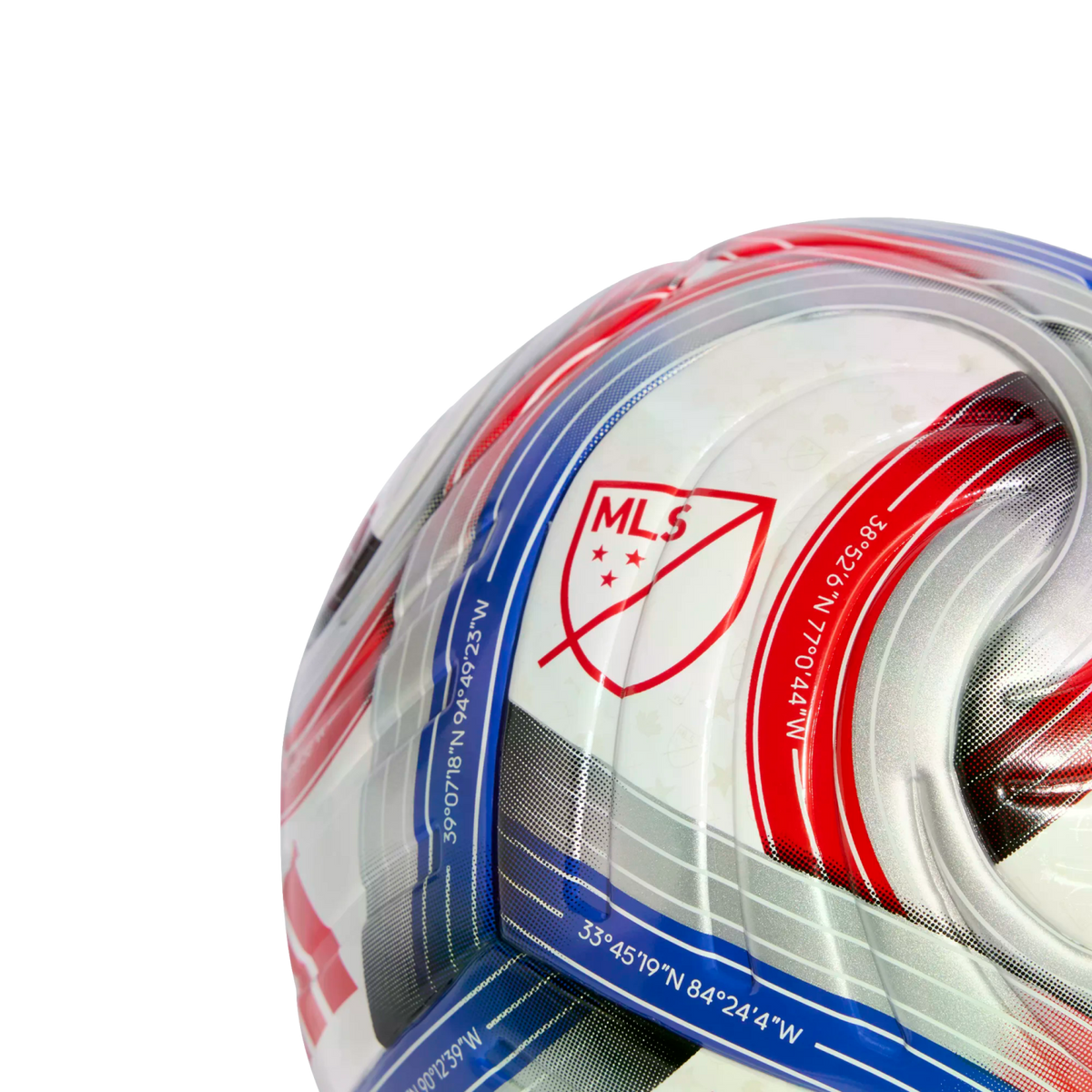 Close-up of an official MLS soccer ball featuring the league crest, red and blue stripes, and geographical coordinates printed along the patterned panels.