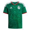 Green Mexico soccer jersey featuring an intricate Aztec graphic, white shoulder stripes, and red trim on the collar and cuffs. The team crest and Adidas logo are on the chest.